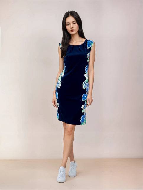 Apt.9 Dress Size XS in navy with blue floral side panels, modeled for Margaret’s Fine Consignments. Sleeveless, casual and elegant fit.