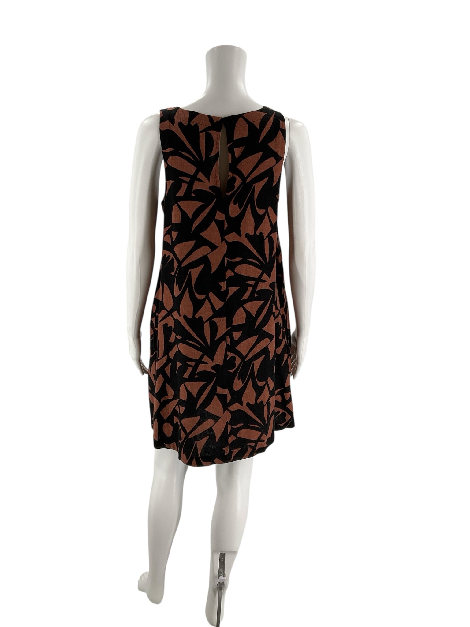 A New Day sleeveless mini dress in brown and black print, pre-owned with tags, size small, A-line shift style.