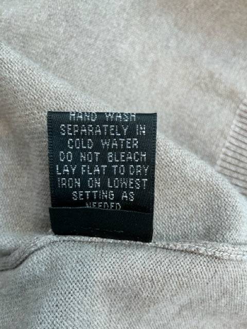 Care label for No Brand Shrug Size XL, indicating hand wash in cold water and lay flat to dry. Found at Margaret’s Fine Consignments.