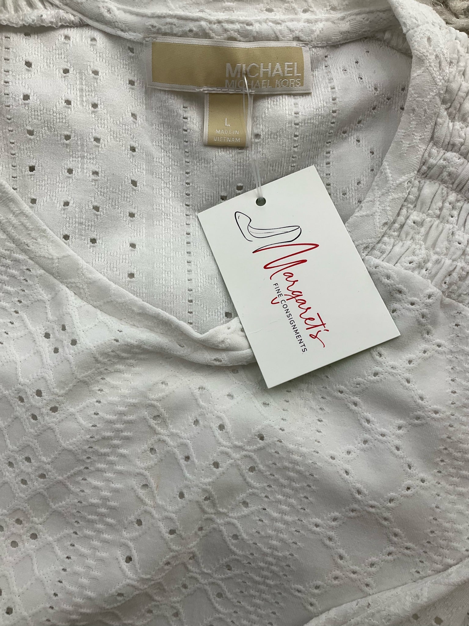 Michael Kors white solid peplum top, sleeveless design, size large, featuring a boho romantic style.