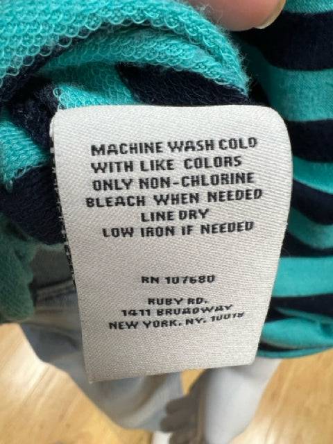 Care label for Ruby Rd Top Size Petite Medium with washing instructions and brand details from Margaret's Consignments.