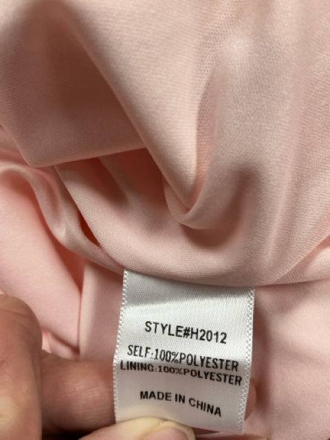 Fabric tag of Jodifl Blush Swiss Dots Dress Size Medium, 100% polyester, style H2012, sold at Margaret’s Fine Consignments.