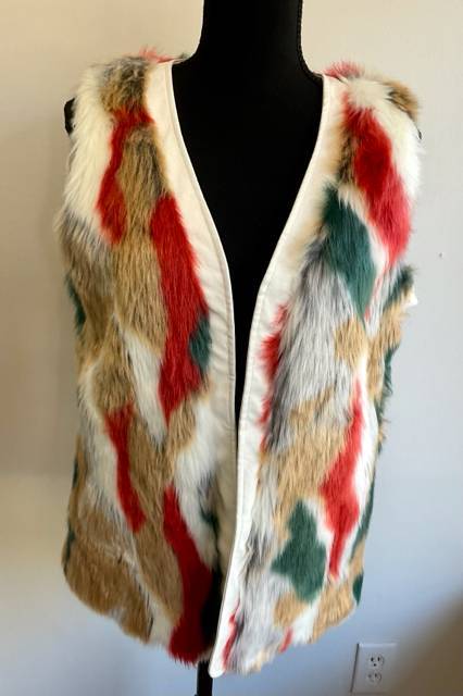 Gracia cream/orange/green faux fur vest in size small displayed on black mannequin, featuring a bold multicolor pattern and open front design.