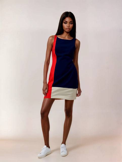 Lauren Ralph Lauren Color Block Dress Size 10 modeled, featuring navy, coral, and cream panels in a sleeveless mini style. Available at Margaret’s Consignments.