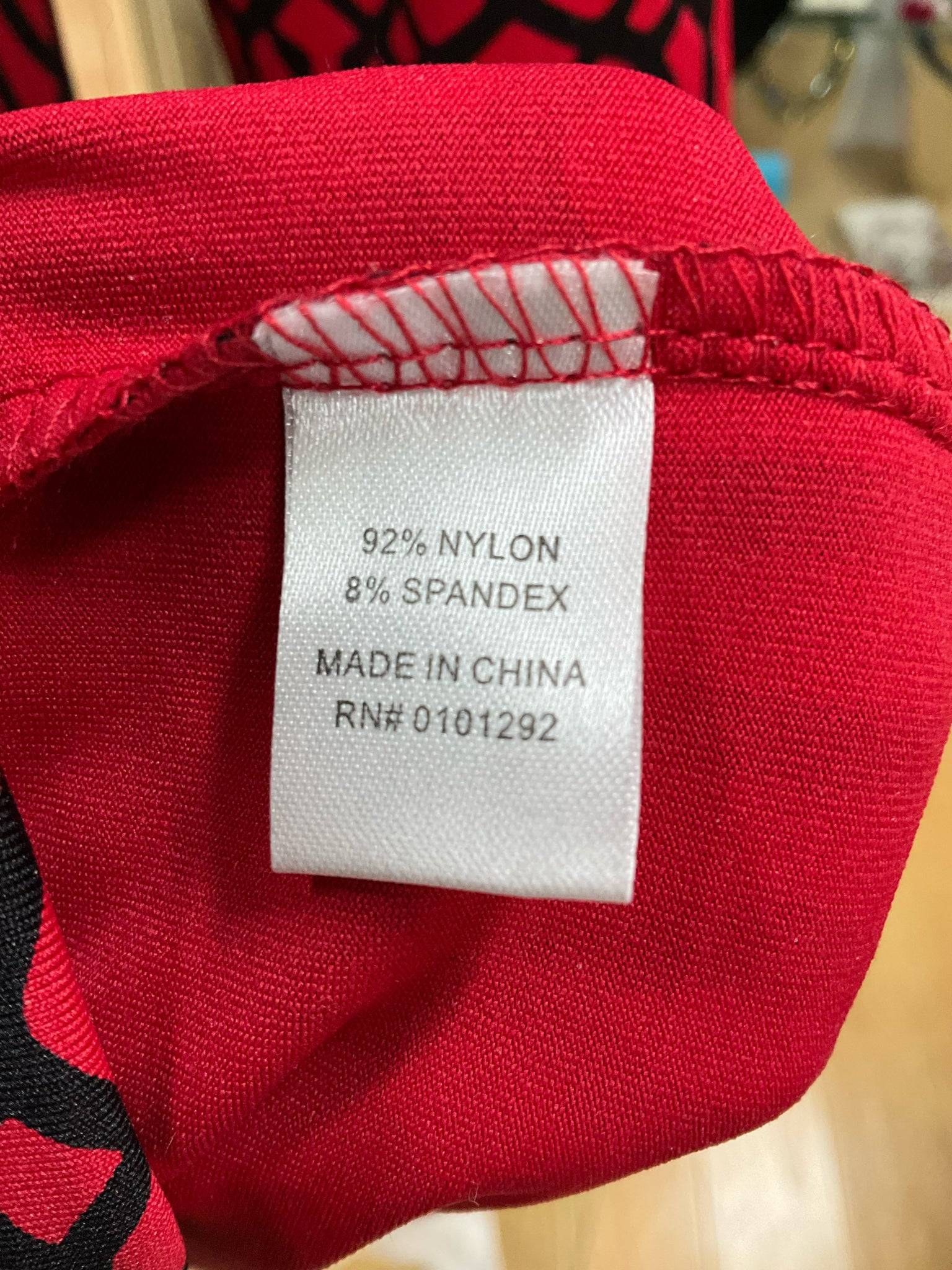 Fabric tag of Lulu B Dress Size Medium showing 92% nylon and 8% spandex composition, made in China, sold by Margaret’s Fine Consignments.