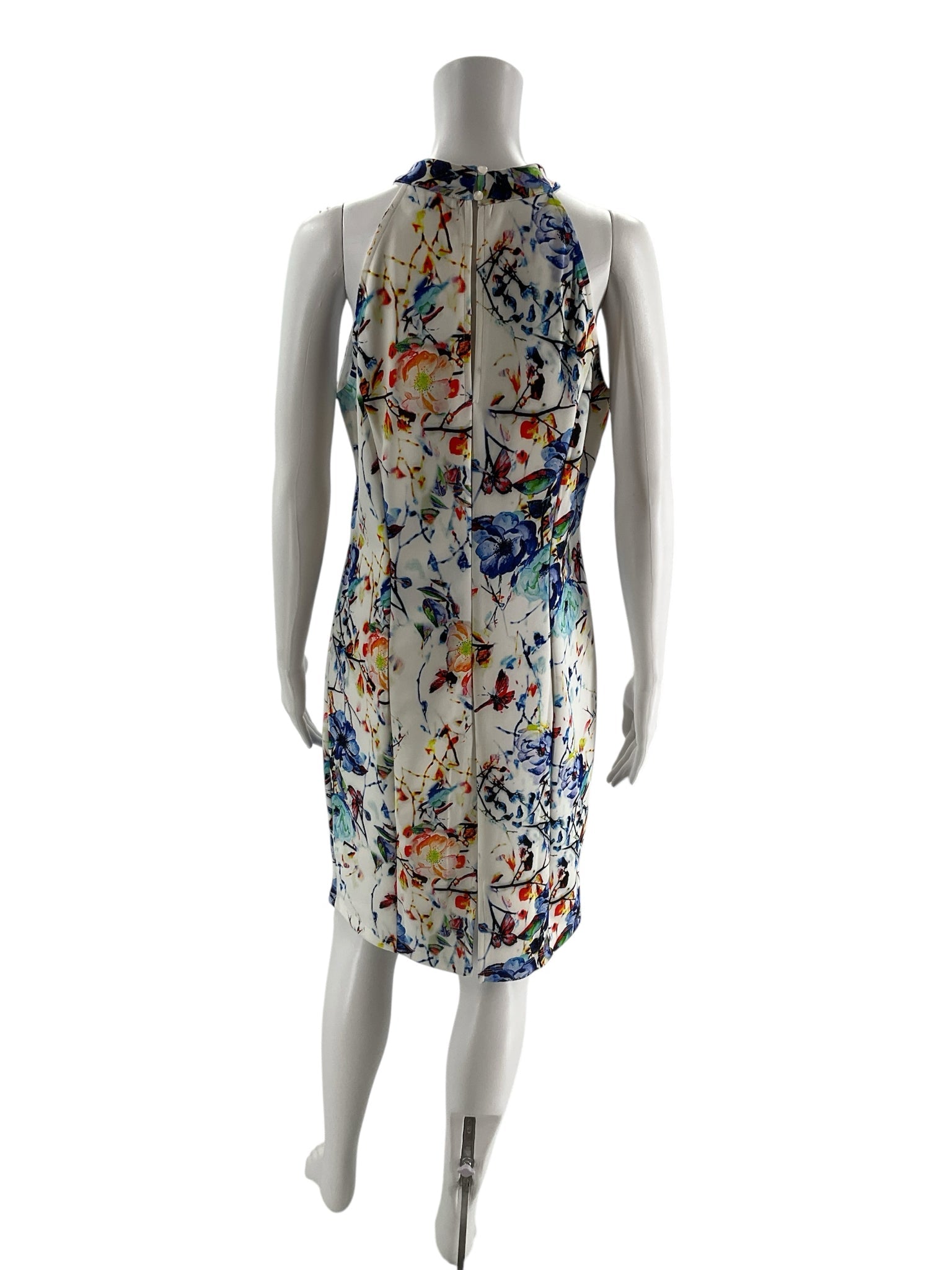 Back view of Venus Watercolor Floral Halter Dress, showing zipper closure and racerback style on a mannequin, size L.