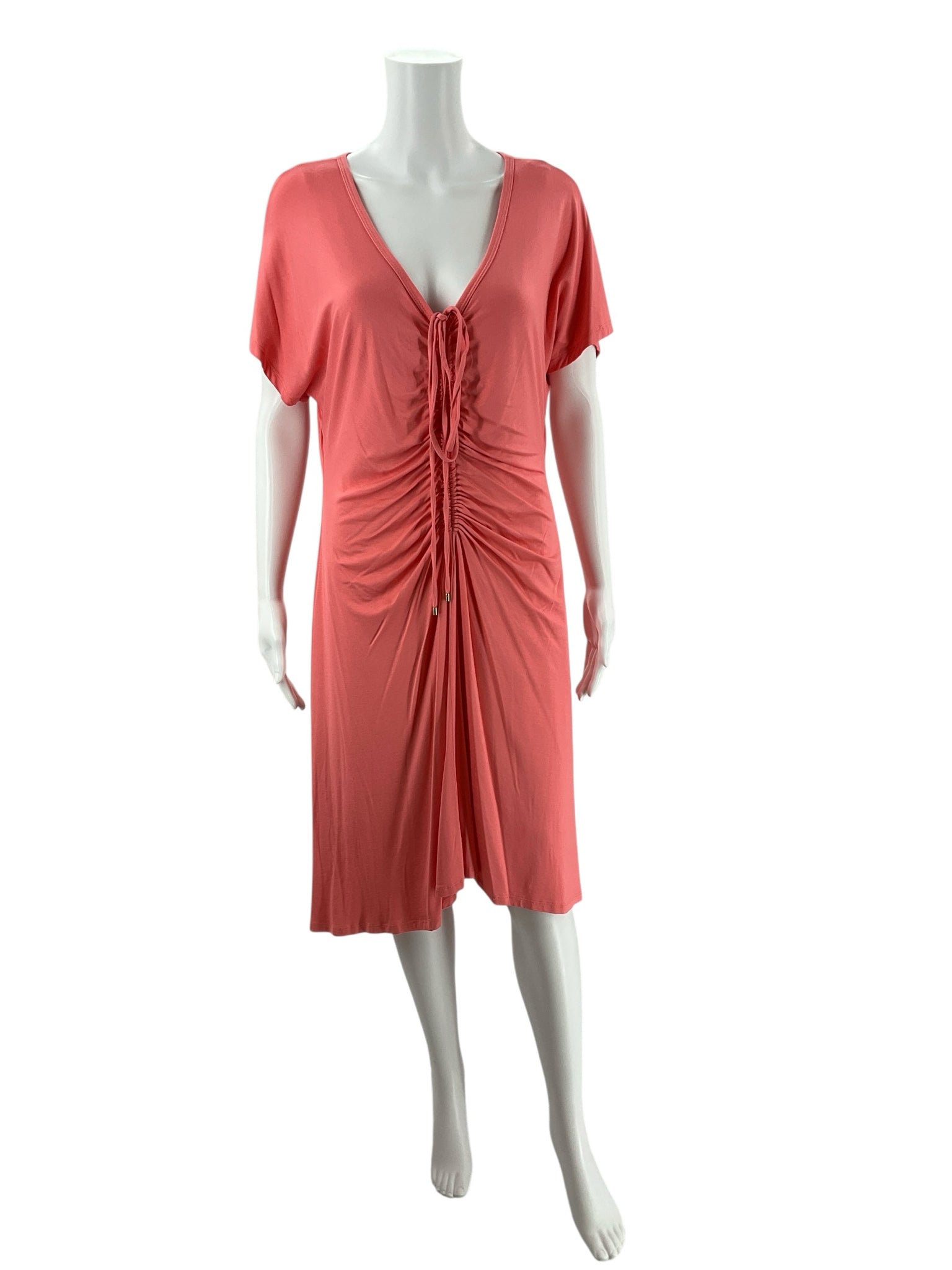 Pre-owned Trina Turk coral midi dress on mannequin, featuring tie-front detail, v-neckline, and short kimono sleeves. Size Large, stretch jersey.