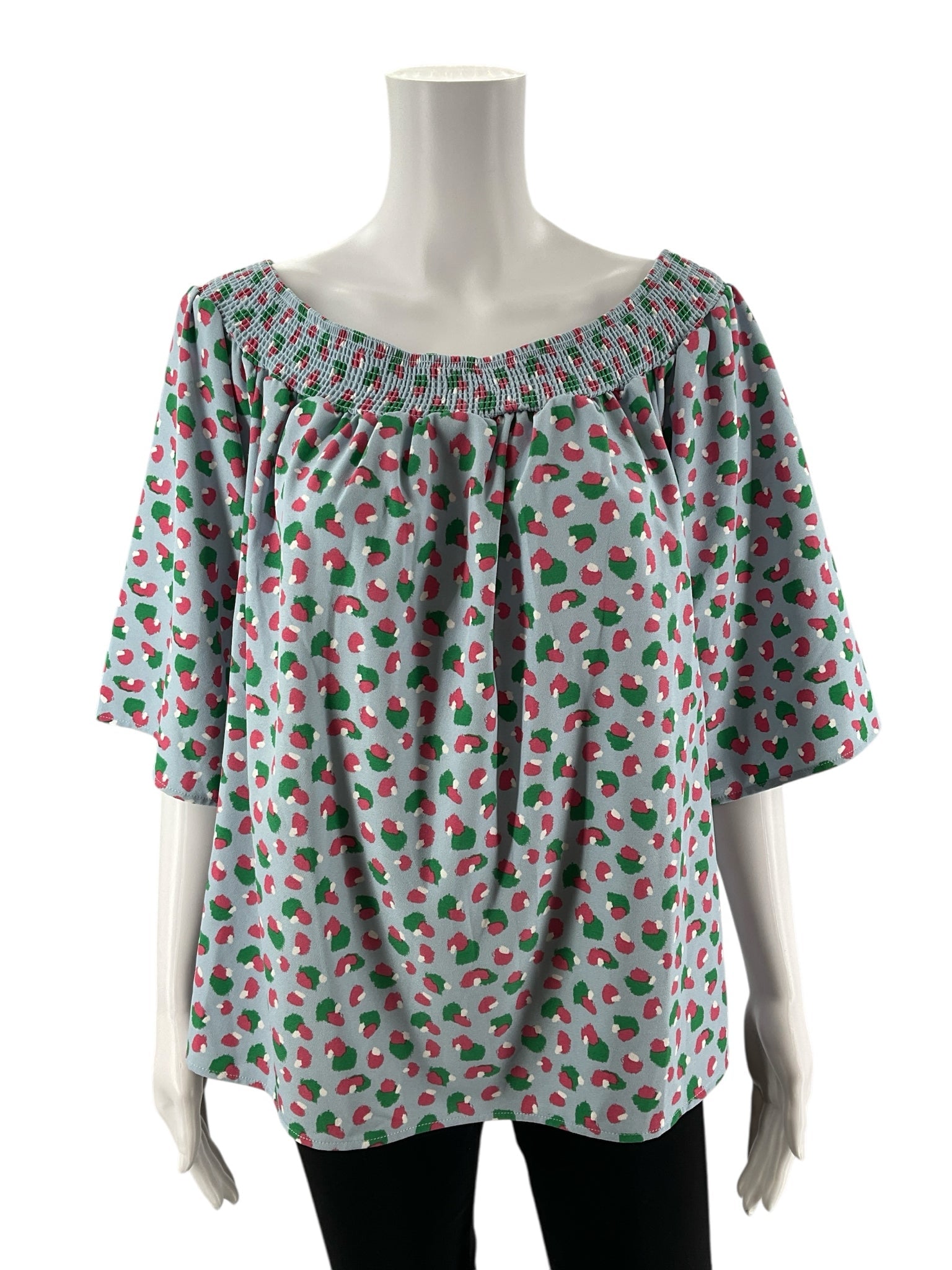 Off-the-shoulder bohemian top by Michelle McDowell in blue, pink, and green print with bell sleeves, size large.