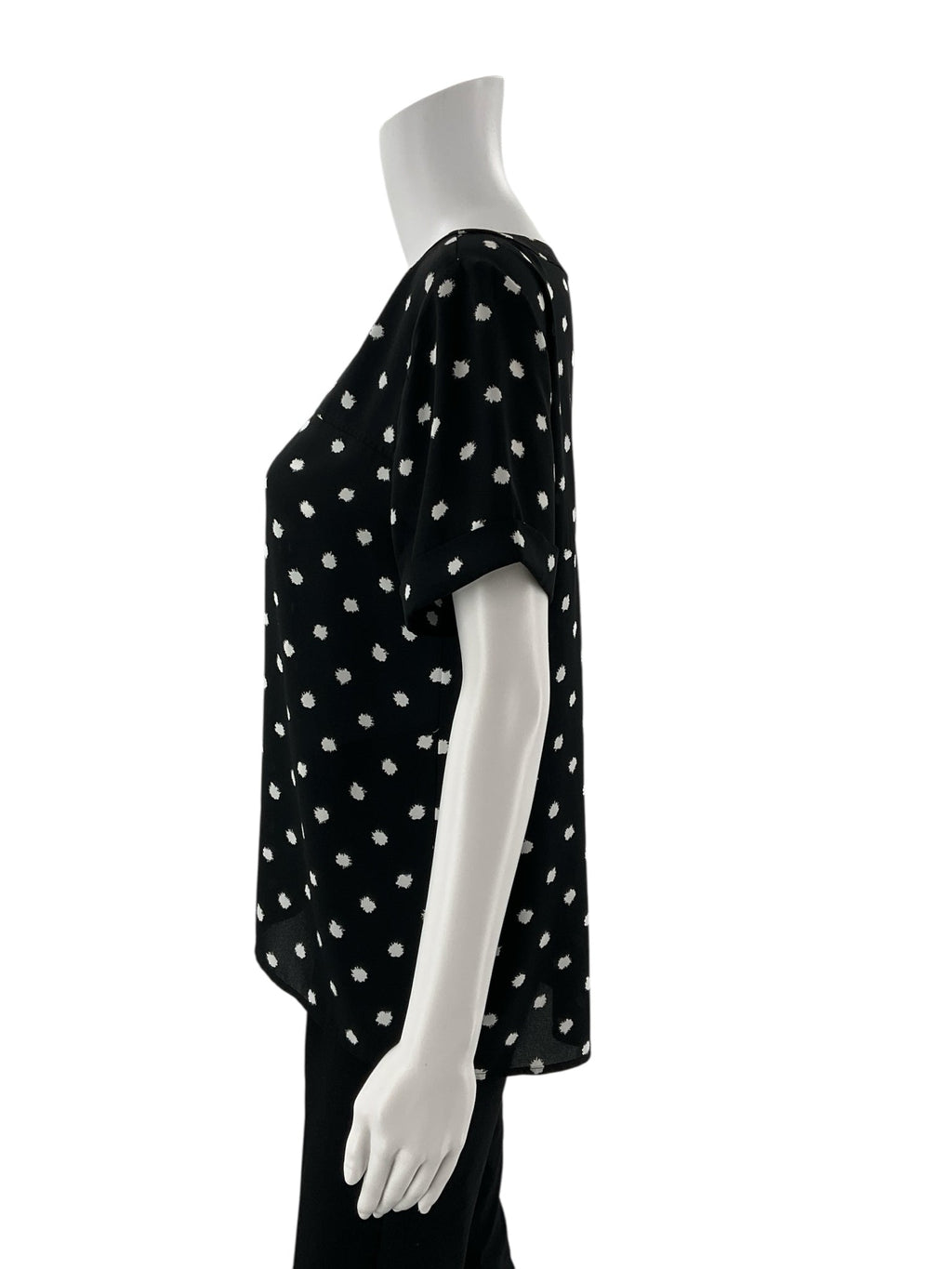 Ann Taylor LOFT black and white polka dot top with boatneck, A-line cut, and high-low hem, size small.