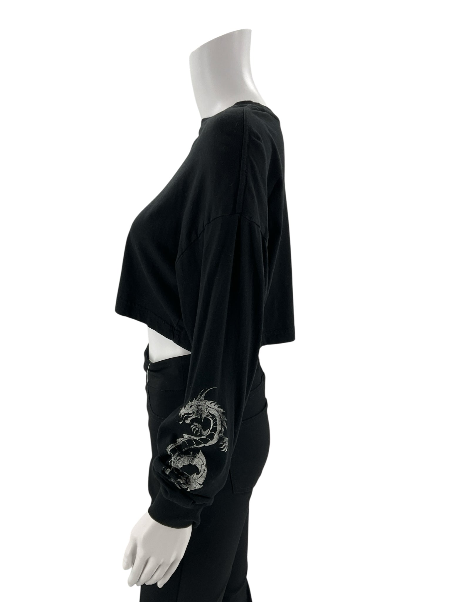 Cropped black long sleeve graphic tee with crew neck from Garage, featuring edgy Y2K design for ladies in size XS.