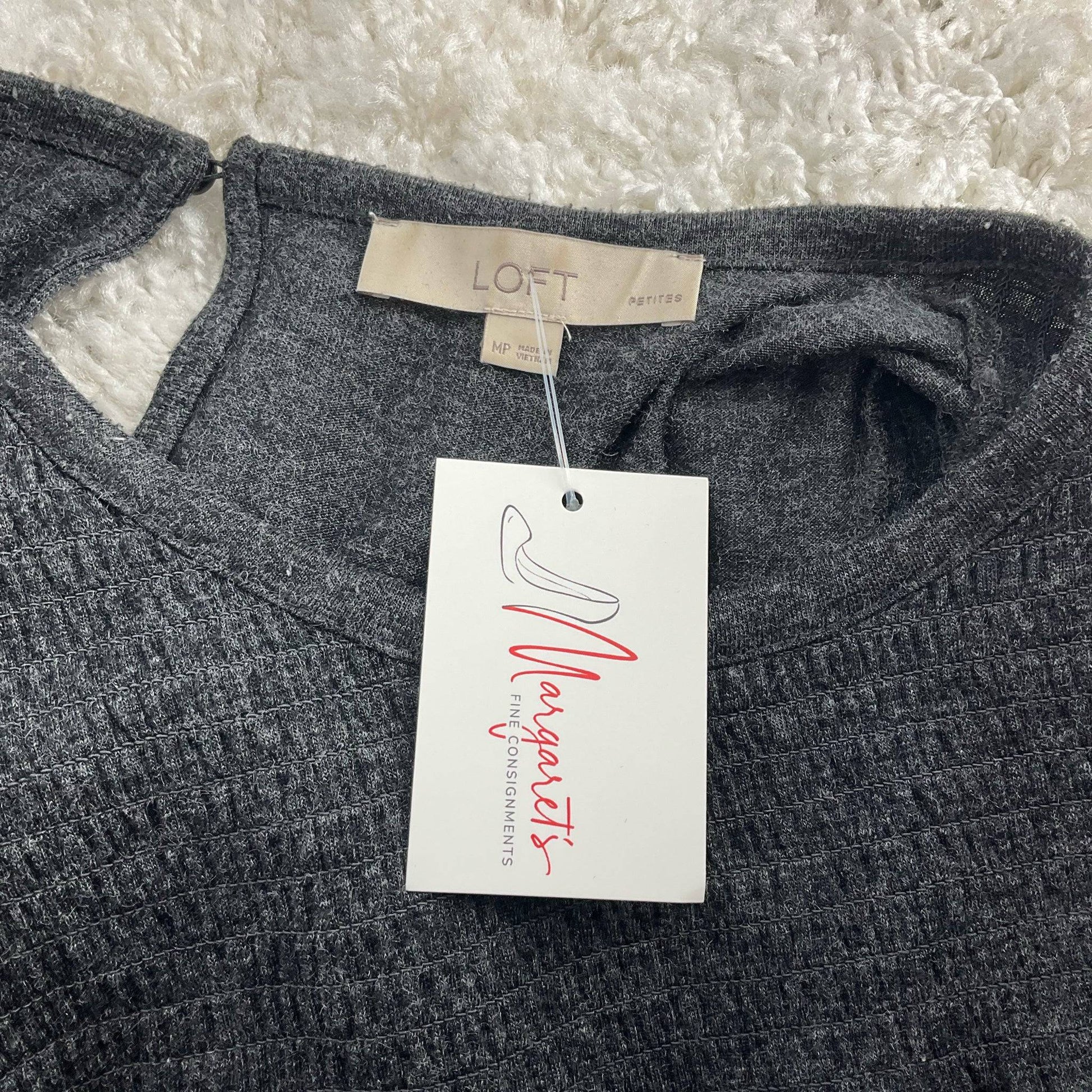 Close-up of Loft label and Margaret's Consignments tag on Gray Solid Dress - Size Medium Petite, confirming authenticity and condition.