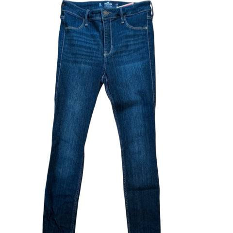 Flat lay of Hollister Jeans Size 3 in dark blue wash, available at Margaret’s Fine Consignments. Features a skinny leg and classic five-pocket design.