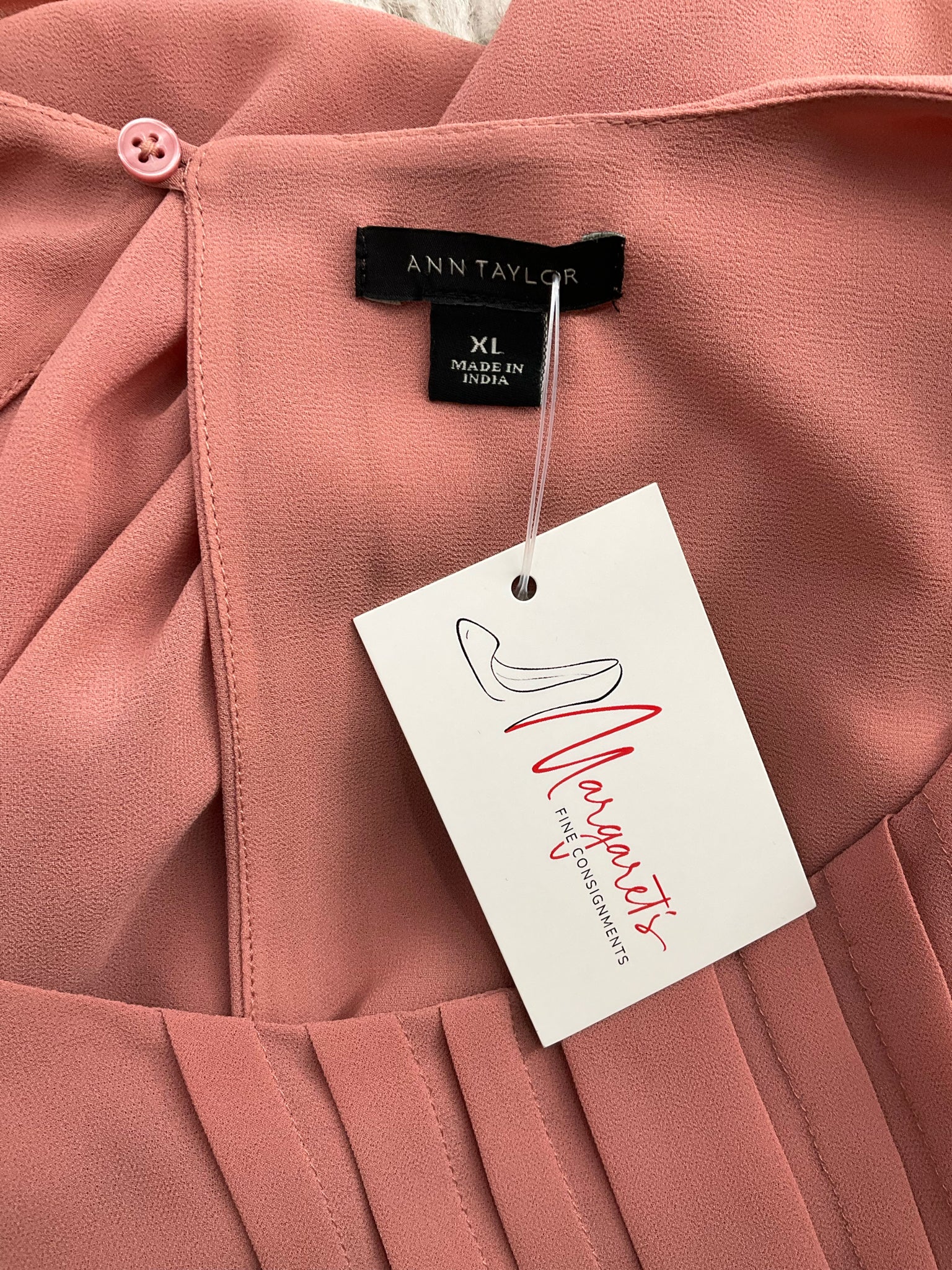 Ann Taylor salmon sleeveless blouse, high-low hem, size XL, featuring a swing top design for a relaxed fit.