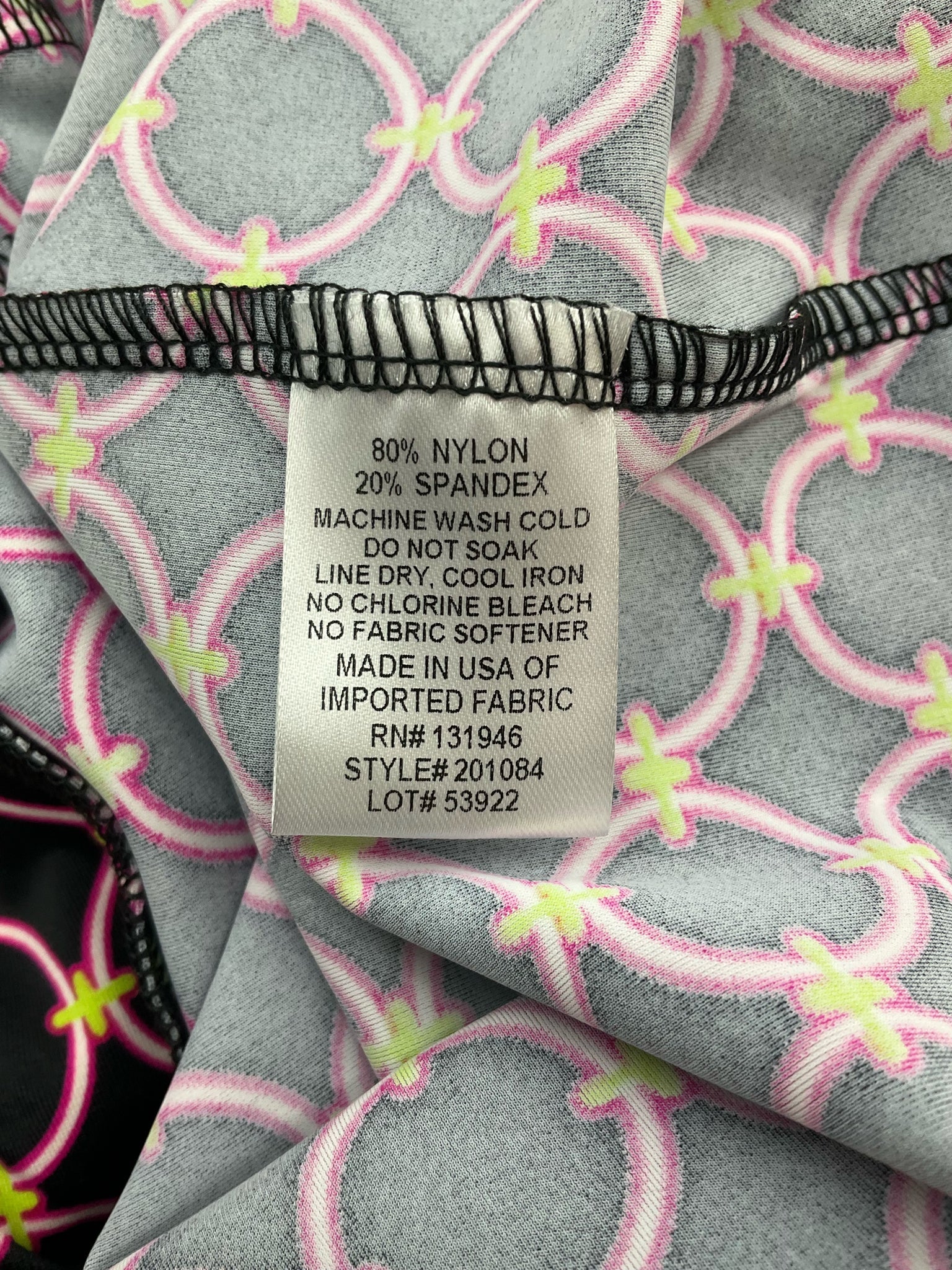 Jude Connally pre-owned ladies cropped pants in black, pink, and green print, size medium, slim leg, ankle length.