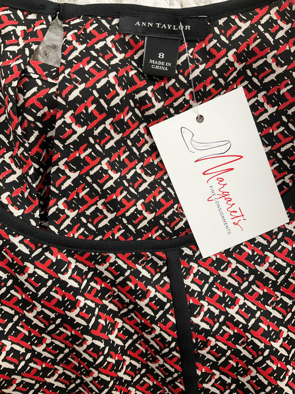 Ann Taylor sleeveless peplum top in black, red, and white print with keyhole back, size 8, perfect for business casual wear.