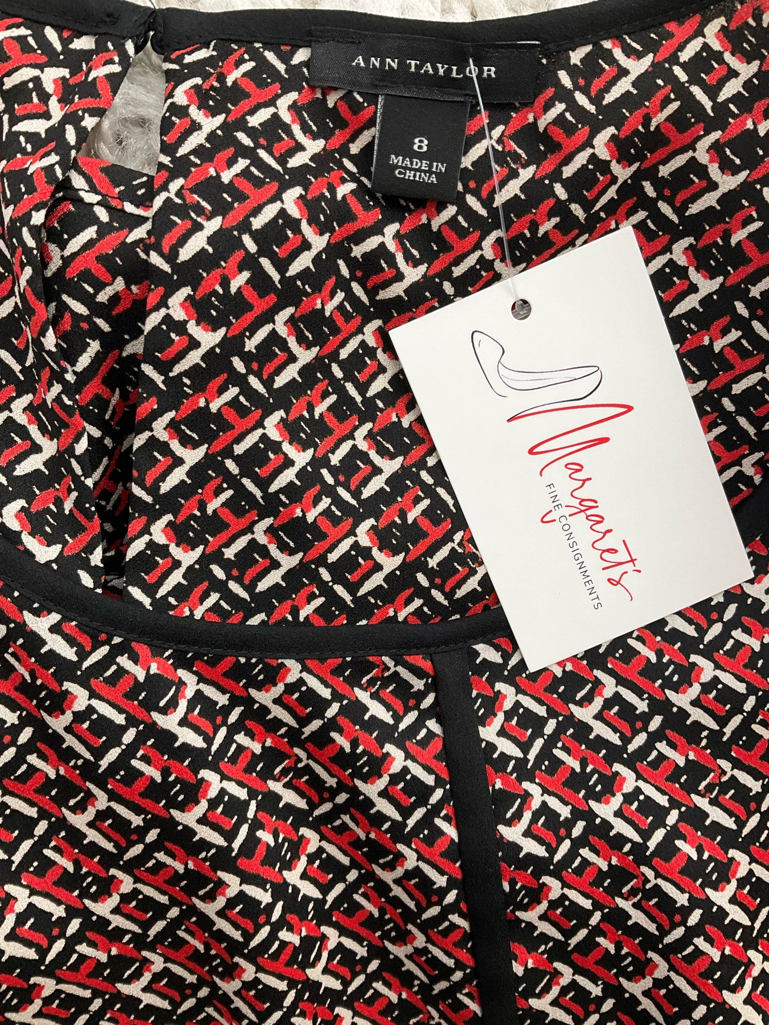 Ann Taylor sleeveless peplum top in black, red, and white print with keyhole back, size 8, perfect for business casual wear.