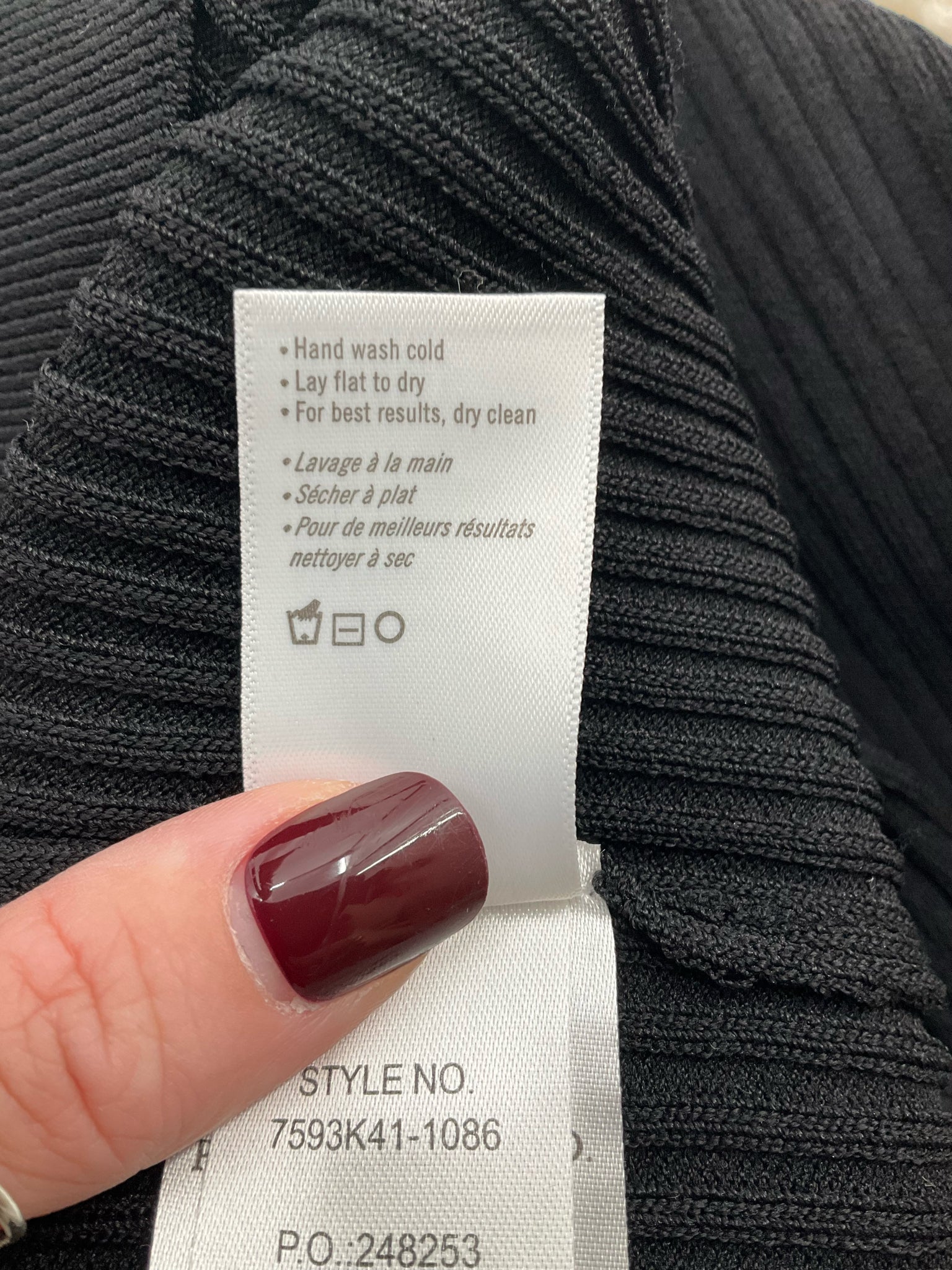 Black ribbed knit top by Paige, featuring a square neck, balloon sleeves, and a pullover design. Size large.