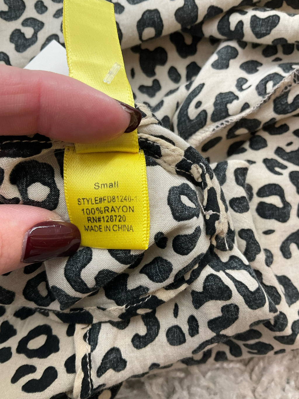 Tan and black animal print blouse by Bee Stitched, casual top, size small, featuring a relaxed tunic style.