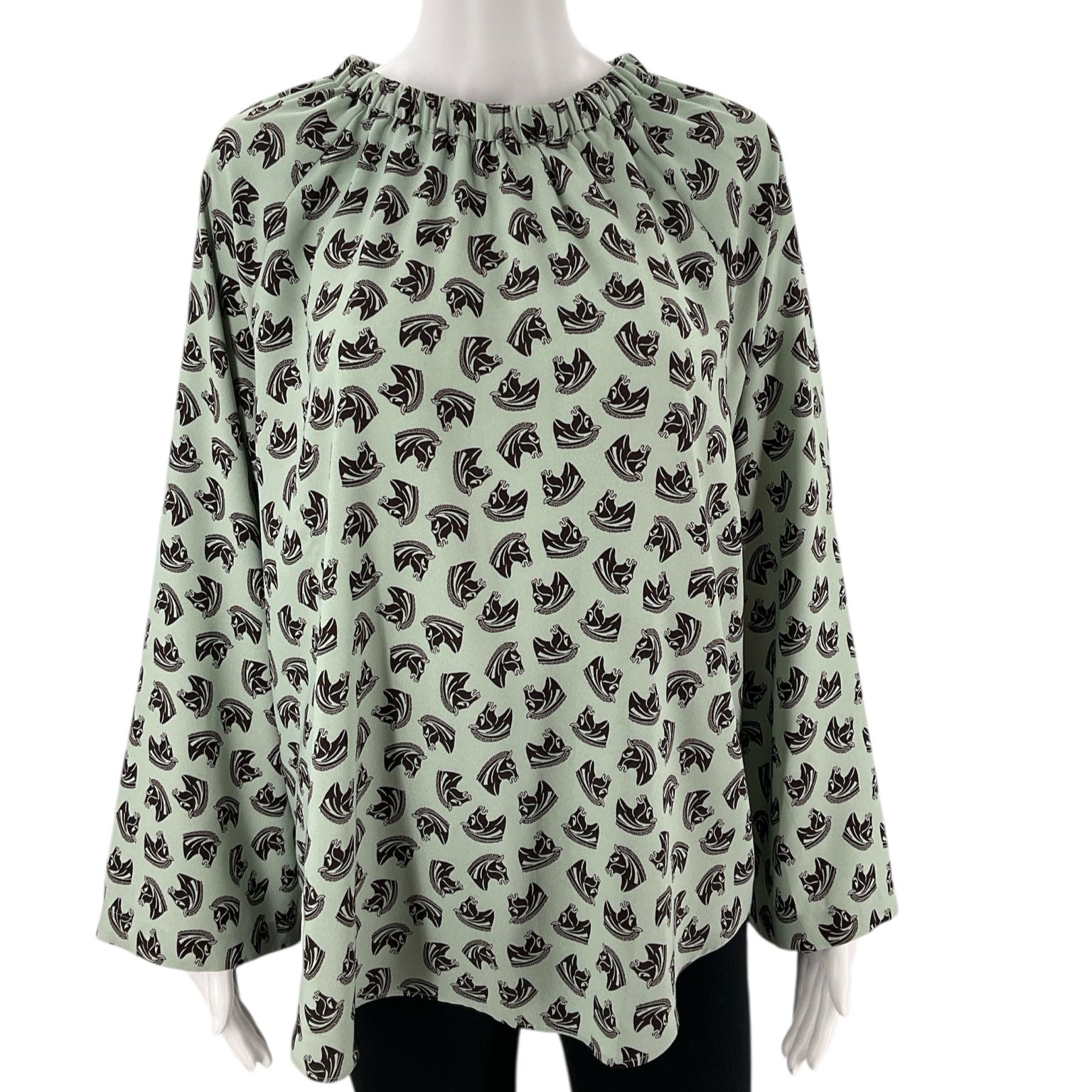 Front view of Ann Taylor Mint/Maroon Pre-Owned Top - Size Large on mannequin, featuring horse print and relaxed fit, available at Margaret’s.