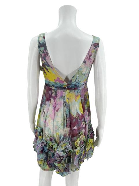 Back view of BCBG Blue/Yellow/Purple Dress Size 2 featuring deep V-back and vibrant floral design, from Margaret’s Fine Consignments.