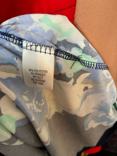 Close-up of fabric tag on Apt.9 Dress Size XS showing 96% polyester and 4% spandex blend, featured at Margaret’s Fine Consignments.