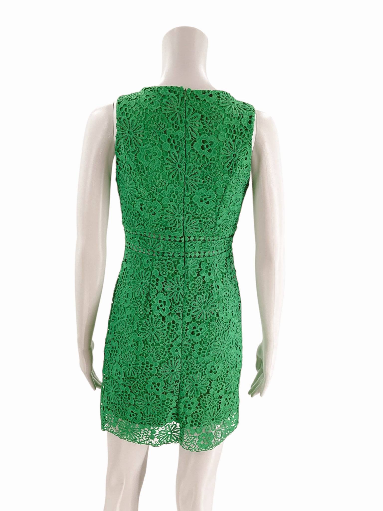 Back view of She + Sky green crochet dress Size Small on mannequin, showcasing floral lace pattern and hidden zipper at Margaret's Fine Consignments.