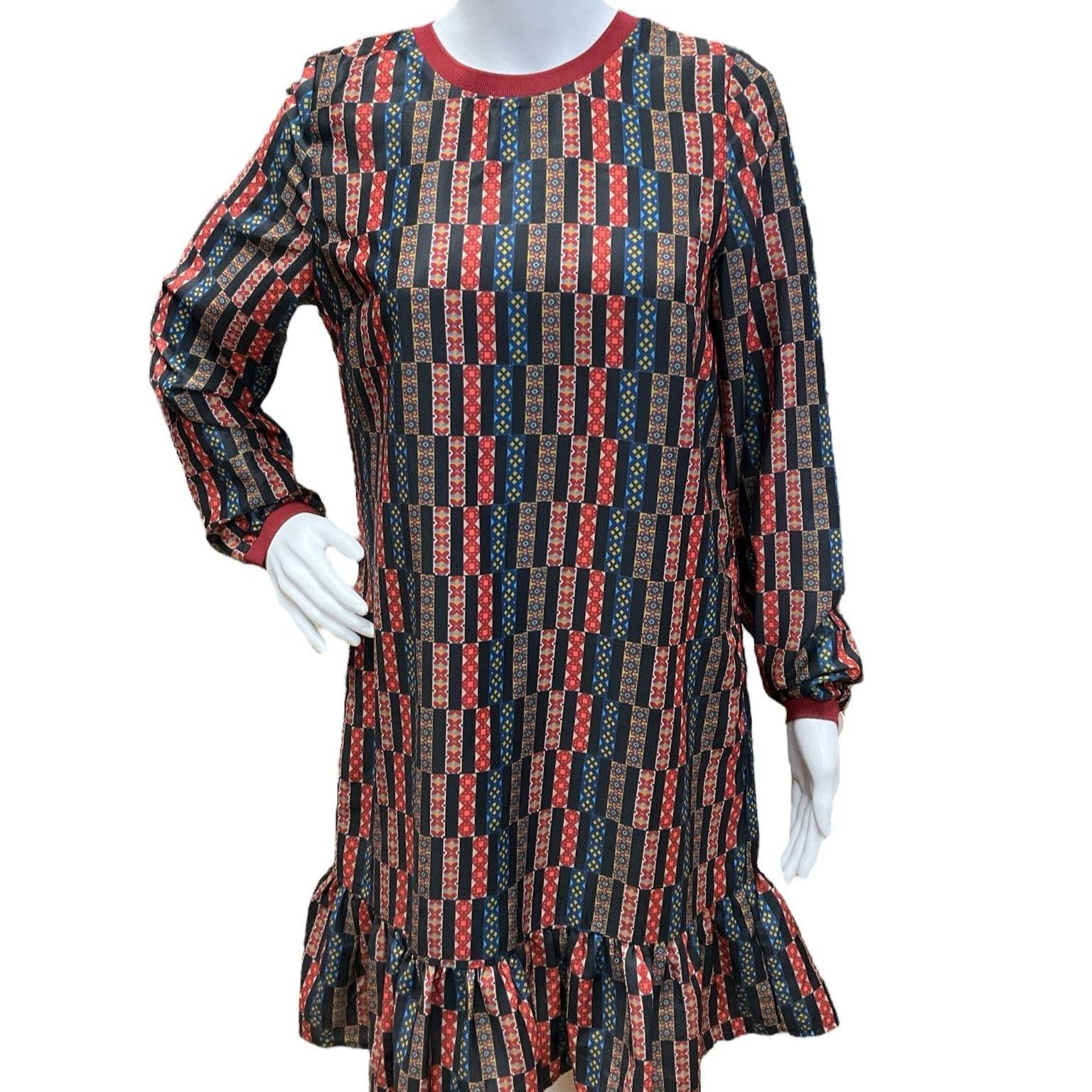 Pre-owned Joy Joy Dress Size Small in black and rust print with ruffle hem, displayed on mannequin at Margaret’s Fine Consignments.