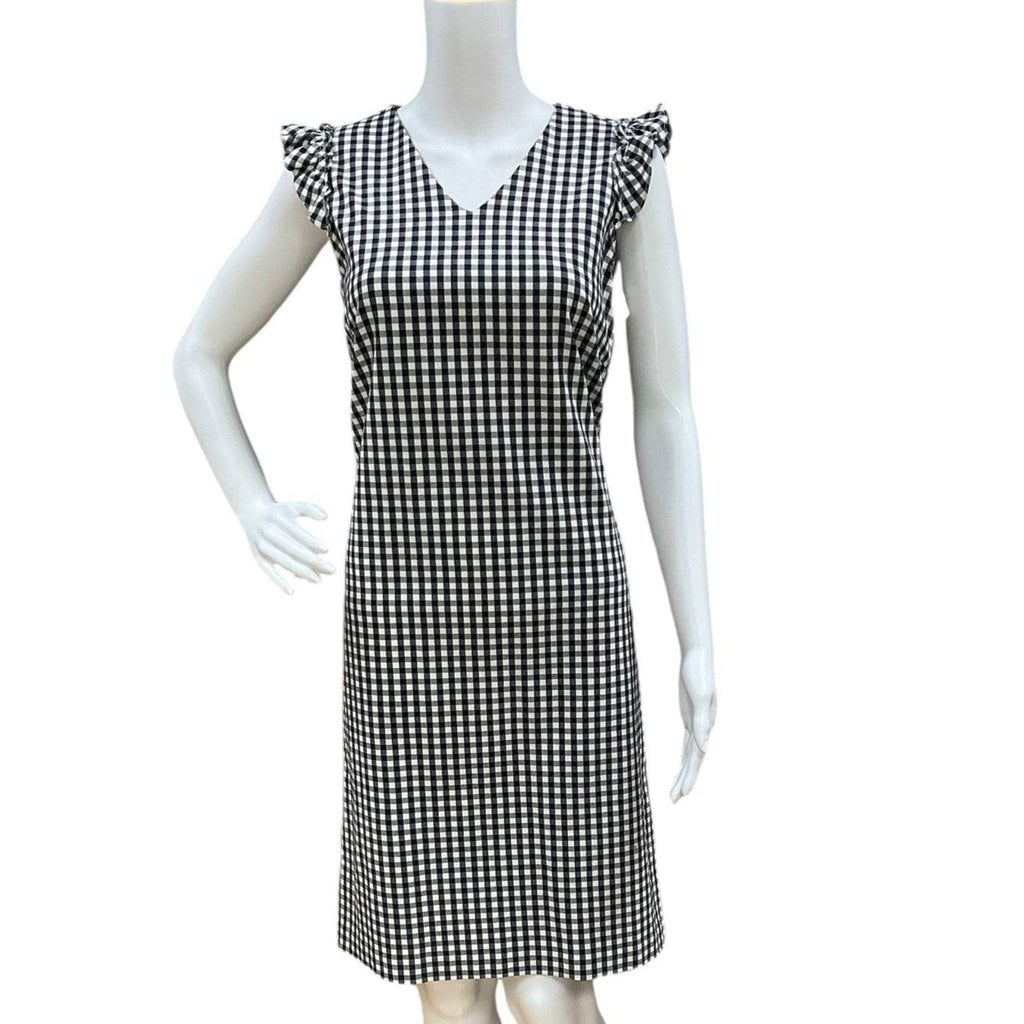 Pre-owned J Mclaughlin navy/white checkered dress size 6 displayed on mannequin, sleeveless with V-neck and ruffle sleeves at Margaret’s Fine Consignments.