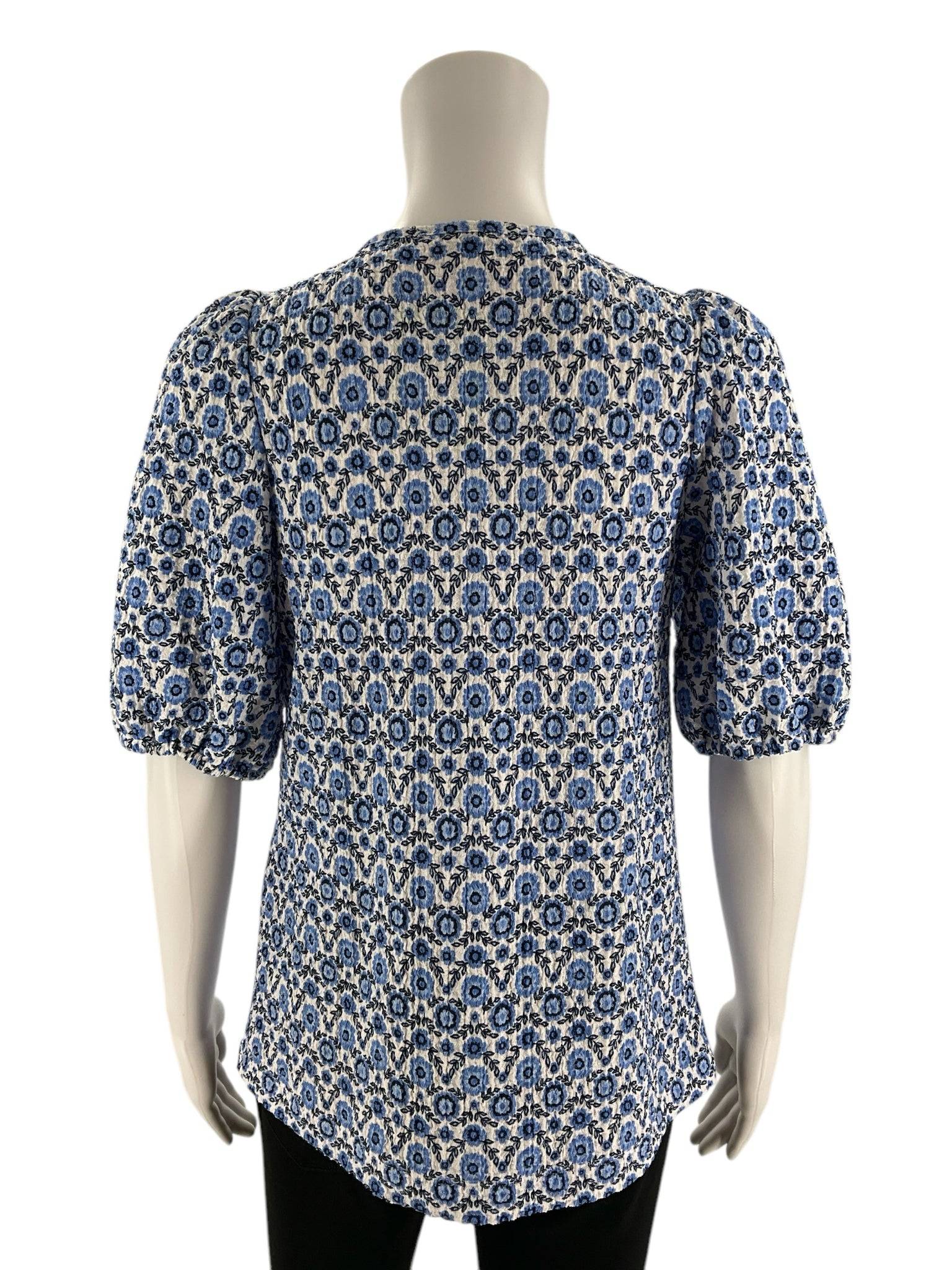 Back view of LOFT Top Size XS featuring blue/white floral design and puff sleeves. Shop this casual top at Margaret’s Fine Consignments.