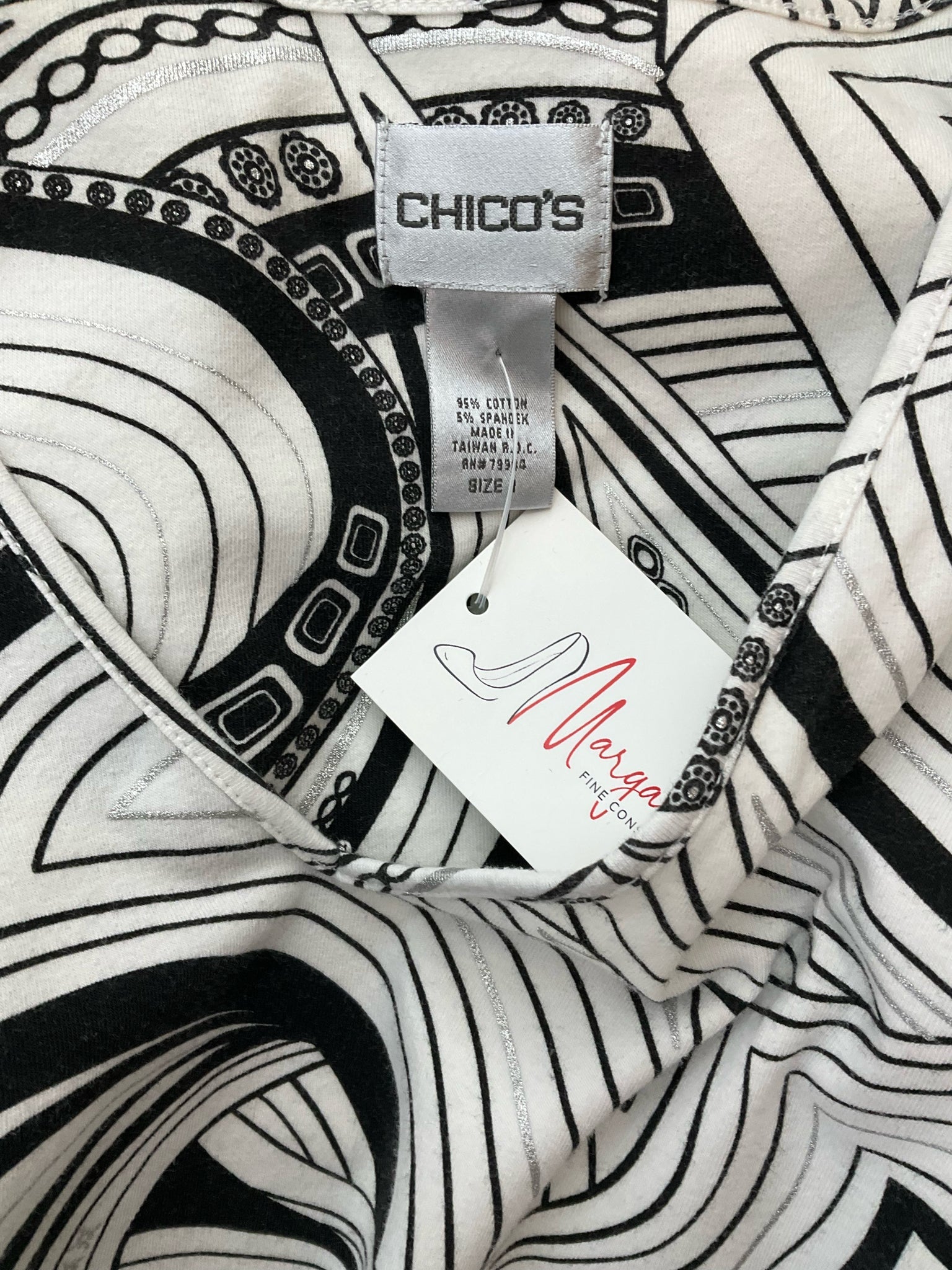 Chico's white and black print V-neck pullover top for women, size medium, displayed on a neutral background.