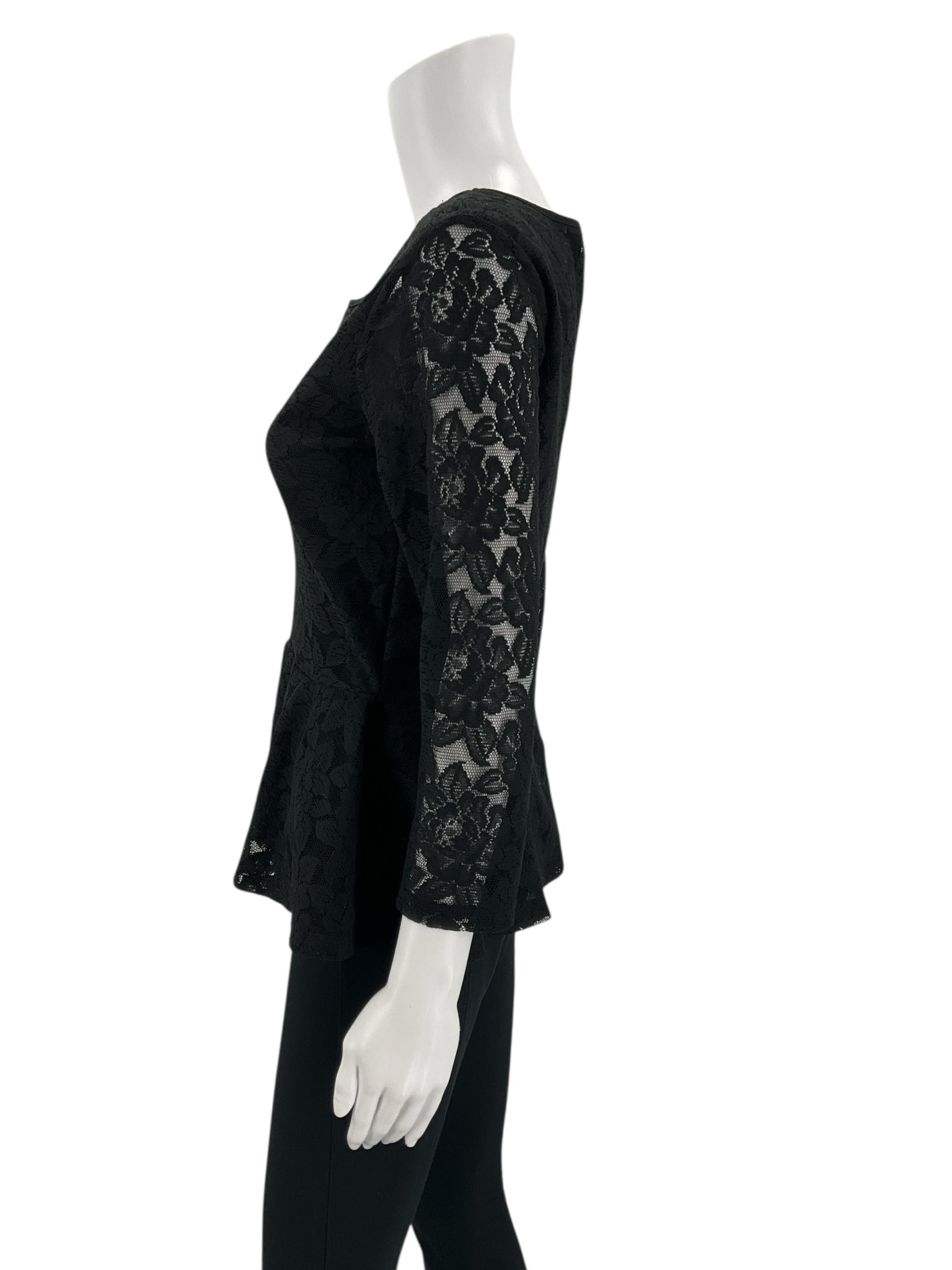 Side profile of Loft Black Lace Pre-Owned Top - Size Small highlighting the peplum flare and sheer lace sleeve detail.