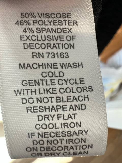 Care label of Cupio Charcoal Heathered Dress Size S showing fabric blend and washing instructions, part of Margaret’s Fine Consignments collection.