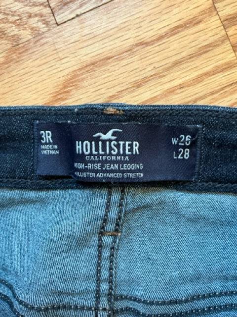 Close-up of Hollister Jeans Size 3 label showing high-rise jean legging style with 26-inch waist and 28-inch length. Available at Margaret’s Fine Consignments.
