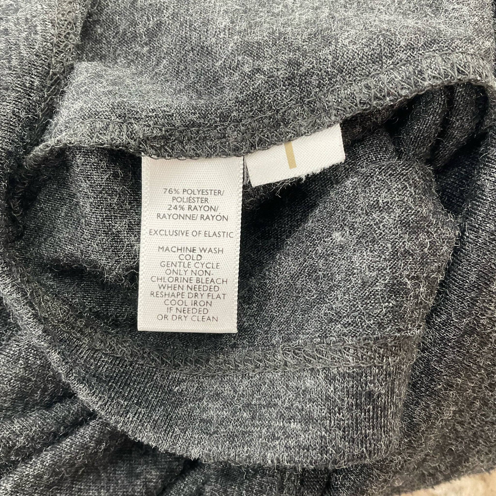 Fabric content tag of Loft Gray Solid Dress - Size Medium Petite showing polyester-rayon blend and care instructions for gentle washing.
