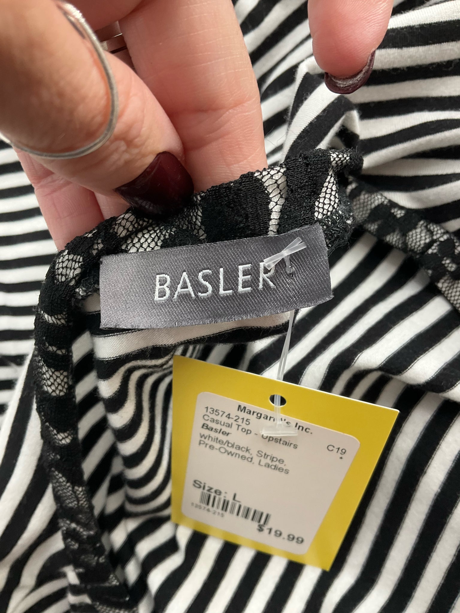 Basler pre-owned ladies top in white and black stripes, size large, showcasing a casual and modern feminine style.