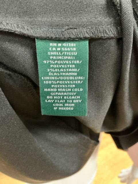 Close-up of fabric care label on Ralph Lauren Black Solid Dress Size 8, showing polyester blend material and care instructions.