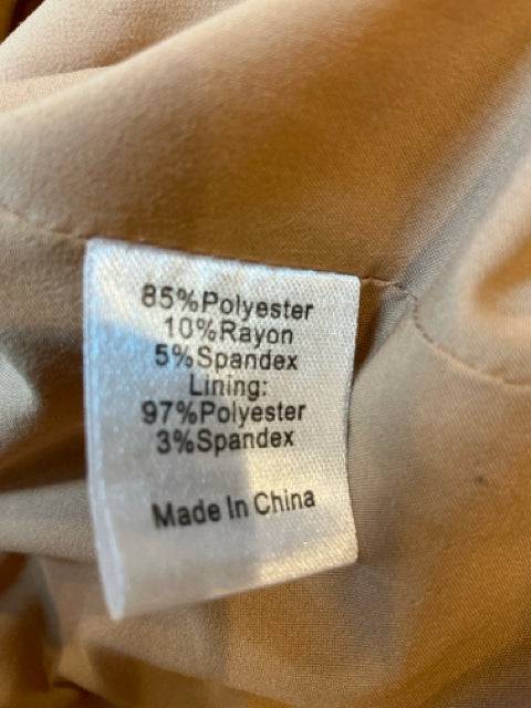 Fabric tag of Tuckernuck Camel Solid Jacket - Size Medium detailing 85% polyester, 10% rayon, 5% spandex blend, made in China.