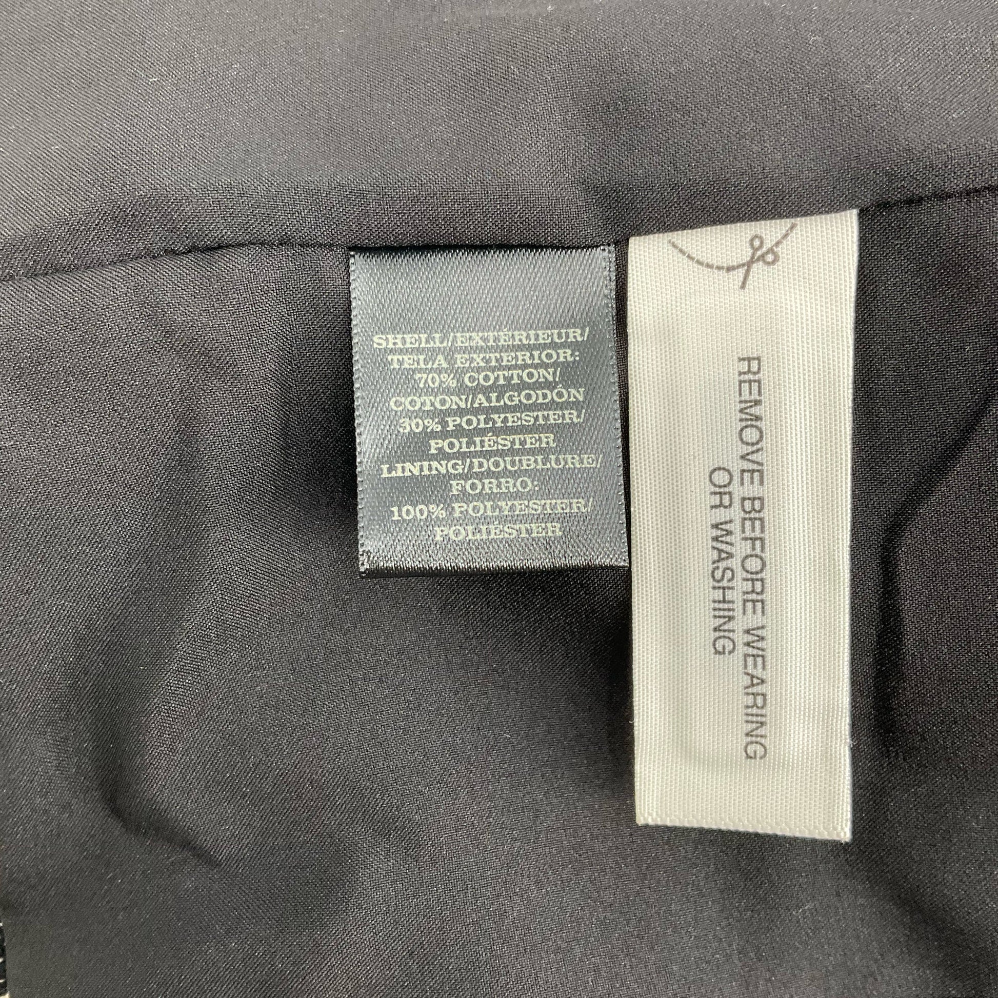 Fabric content tag of Ann Taylor Cream/Black Animal Pre-Owned Jacket - Size XS, showing cotton and polyester blend composition.