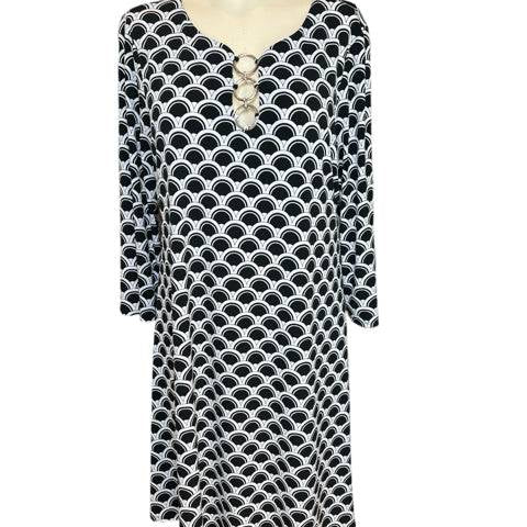 Front view of MSK Dress Size Large with black and white print and ring-accented neckline, pre-owned at Margaret's Fine Consignments.