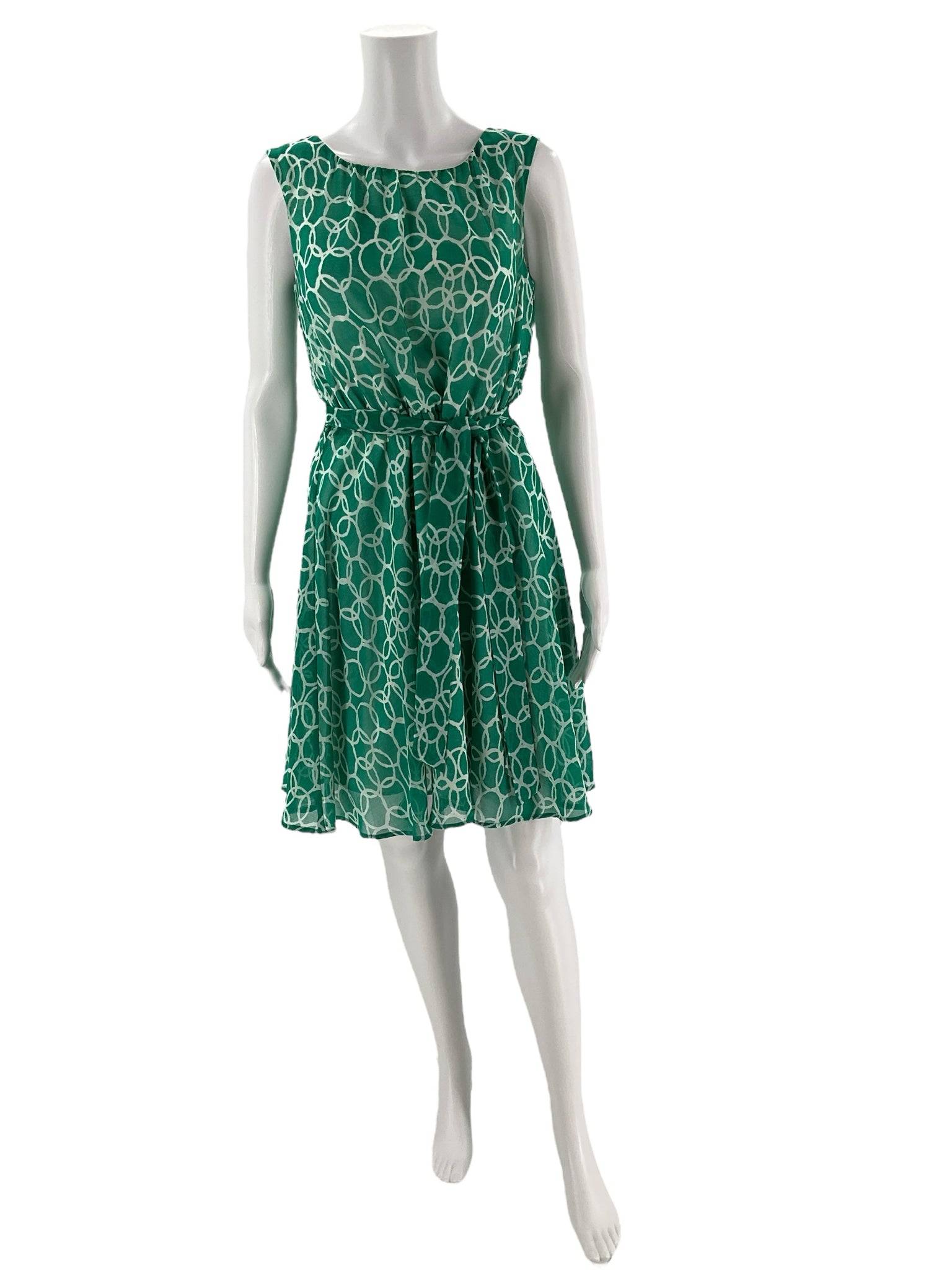Front view of Banana Republic Green/White Print Dress Size 6 Petite on mannequin, sleeveless with a belted waist, sold at Margaret’s Fine Consignments.