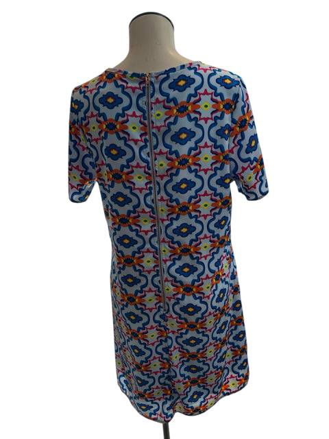 Back view of Peach Love Dress Size Large featuring a visible zipper and bold geometric print, offered by Margaret's Fine Consignments.
