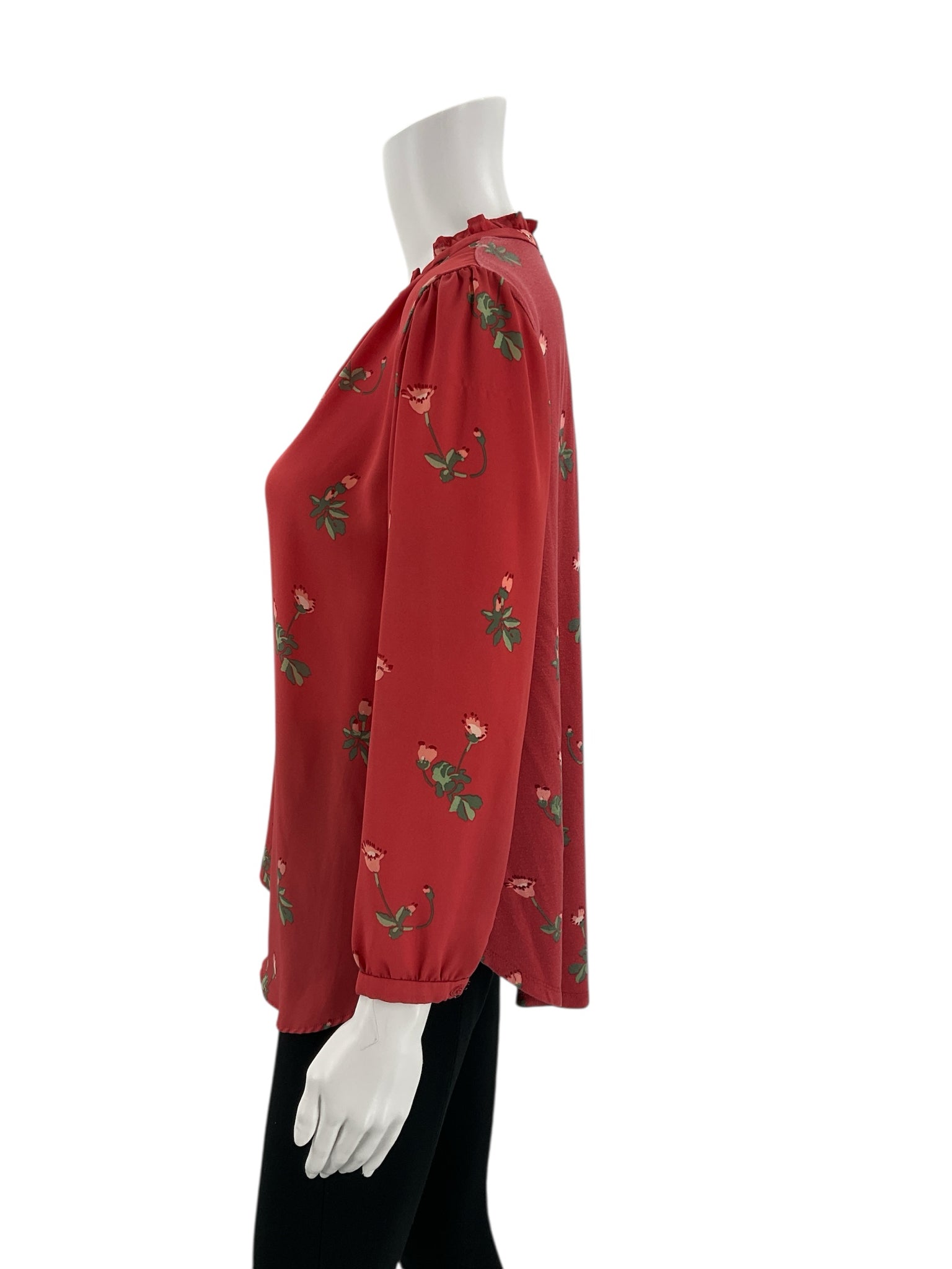 Side profile of Loft red floral blouse, size small, showing flowy silhouette and long sleeves with elastic cuffs, pre-owned condition.