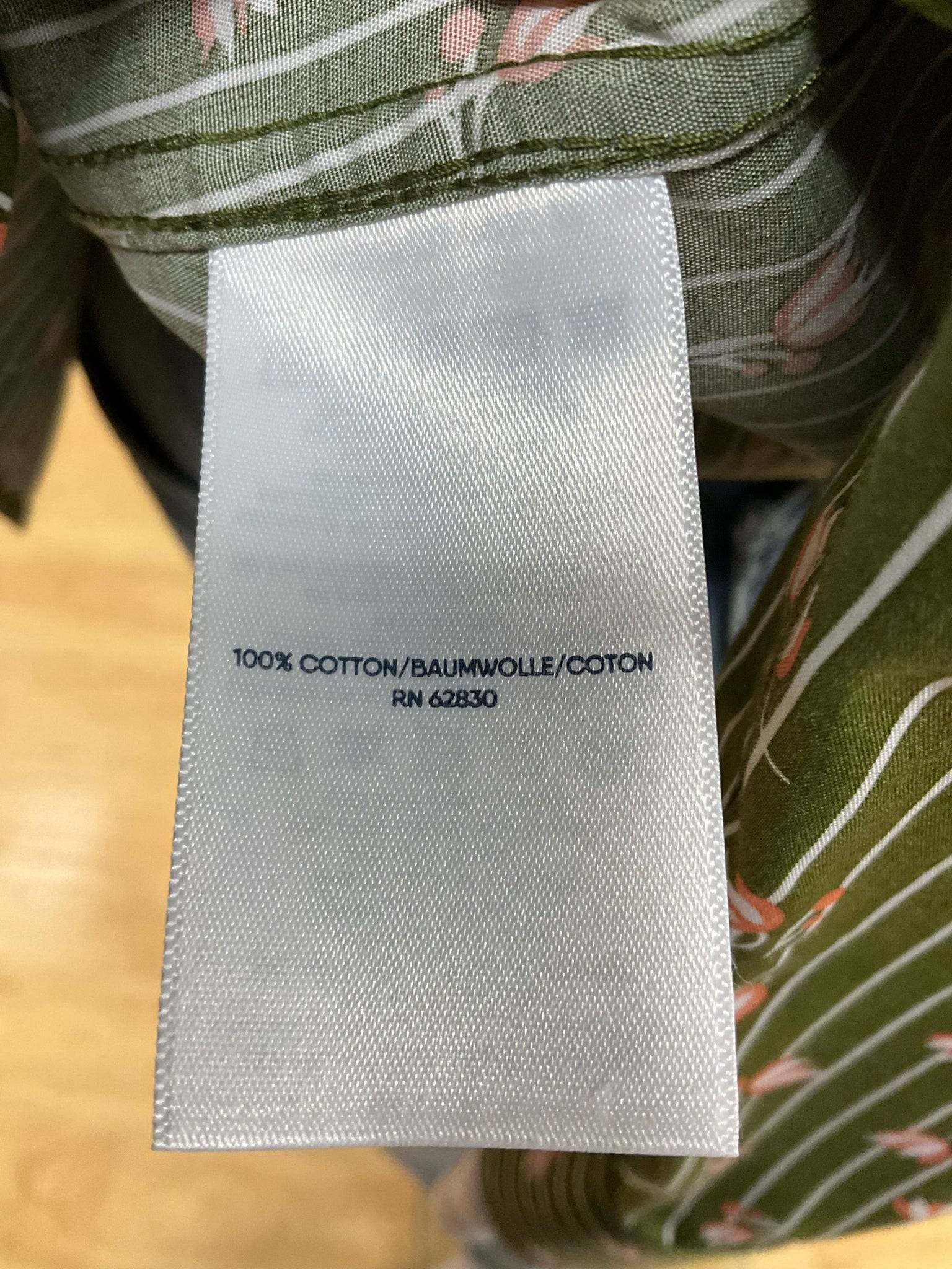 Fabric tag showing 100% cotton composition of Lands End Top Size 10P. Available at Margaret's Fine Consignments.