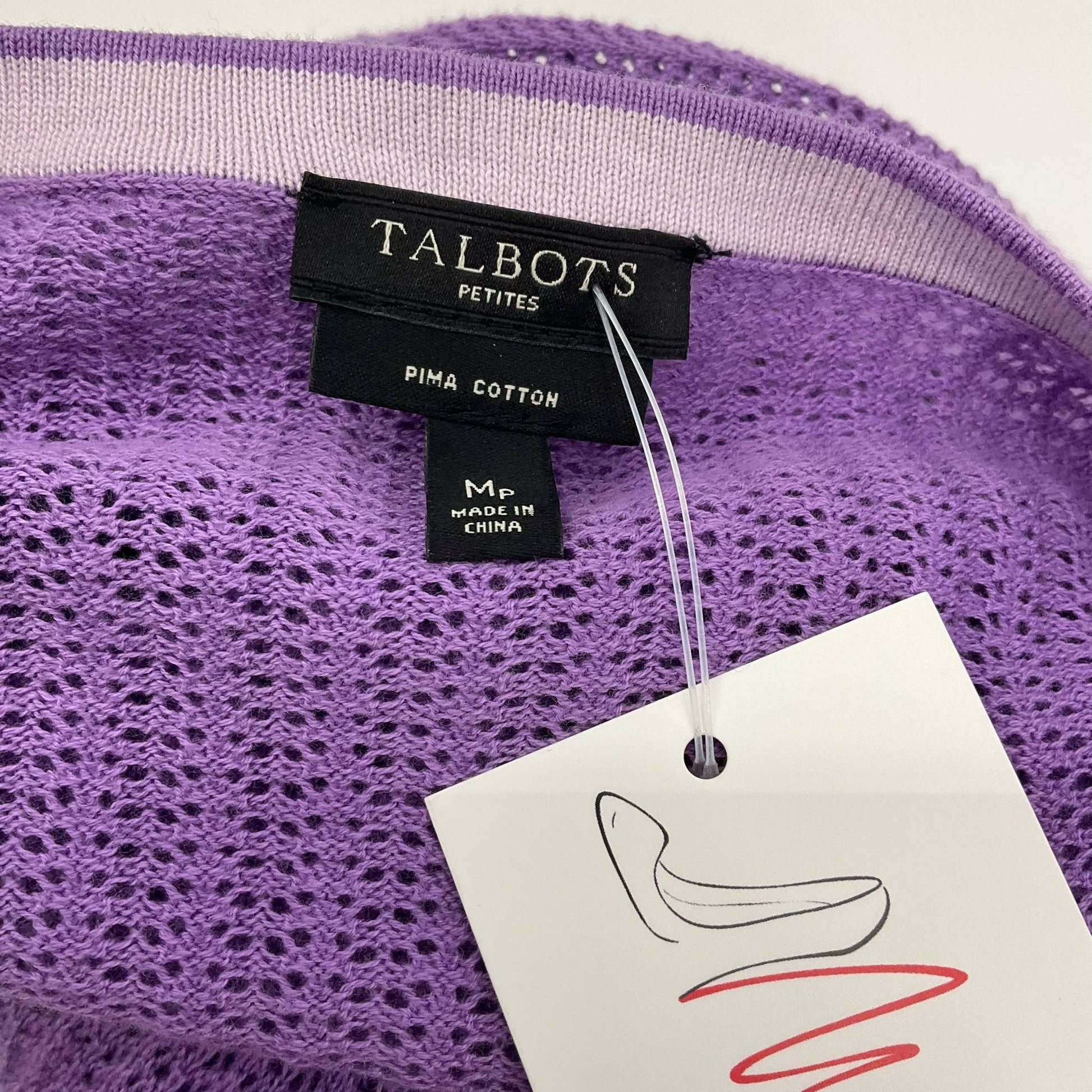 Close-up of Talbots label on lavender mesh top, indicating Petite Medium size and Pima cotton material, available at Margaret’s Fine Consignments.
