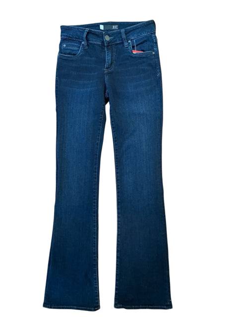 Kut Jeans Size 0 laid flat in dark blue boot cut design, highlighting classic silhouette and gently used quality denim.