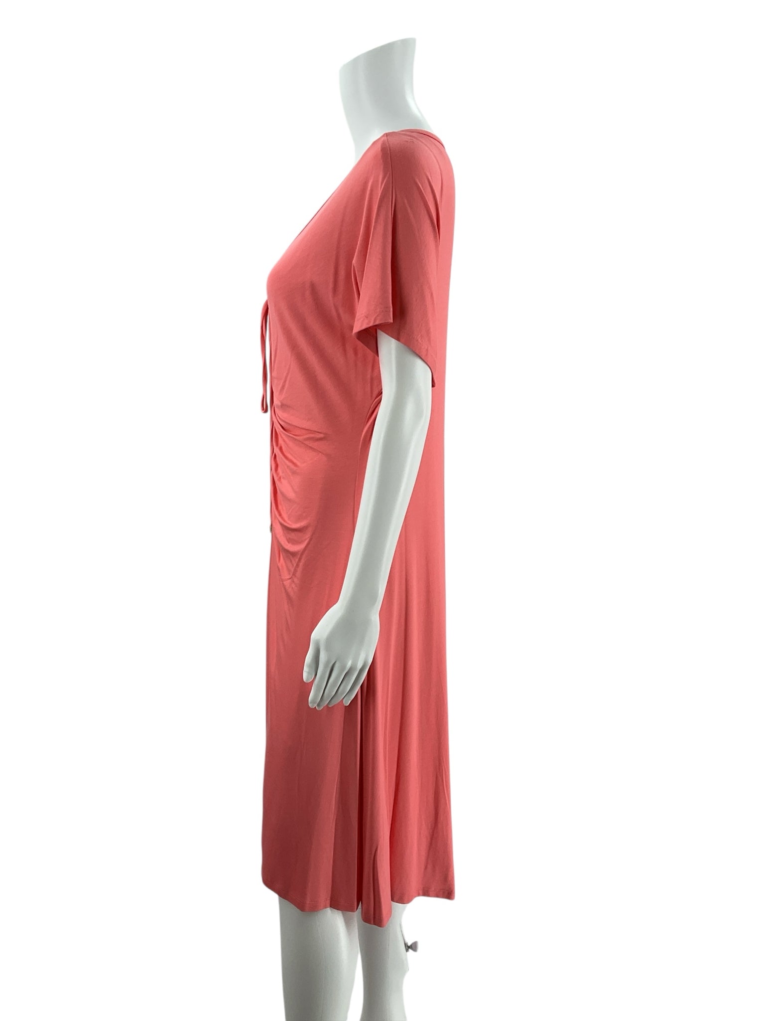 Side profile of Trina Turk coral tie-front midi dress, highlighting short sleeves and draped silhouette. Pre-owned resort wear in size Large.
