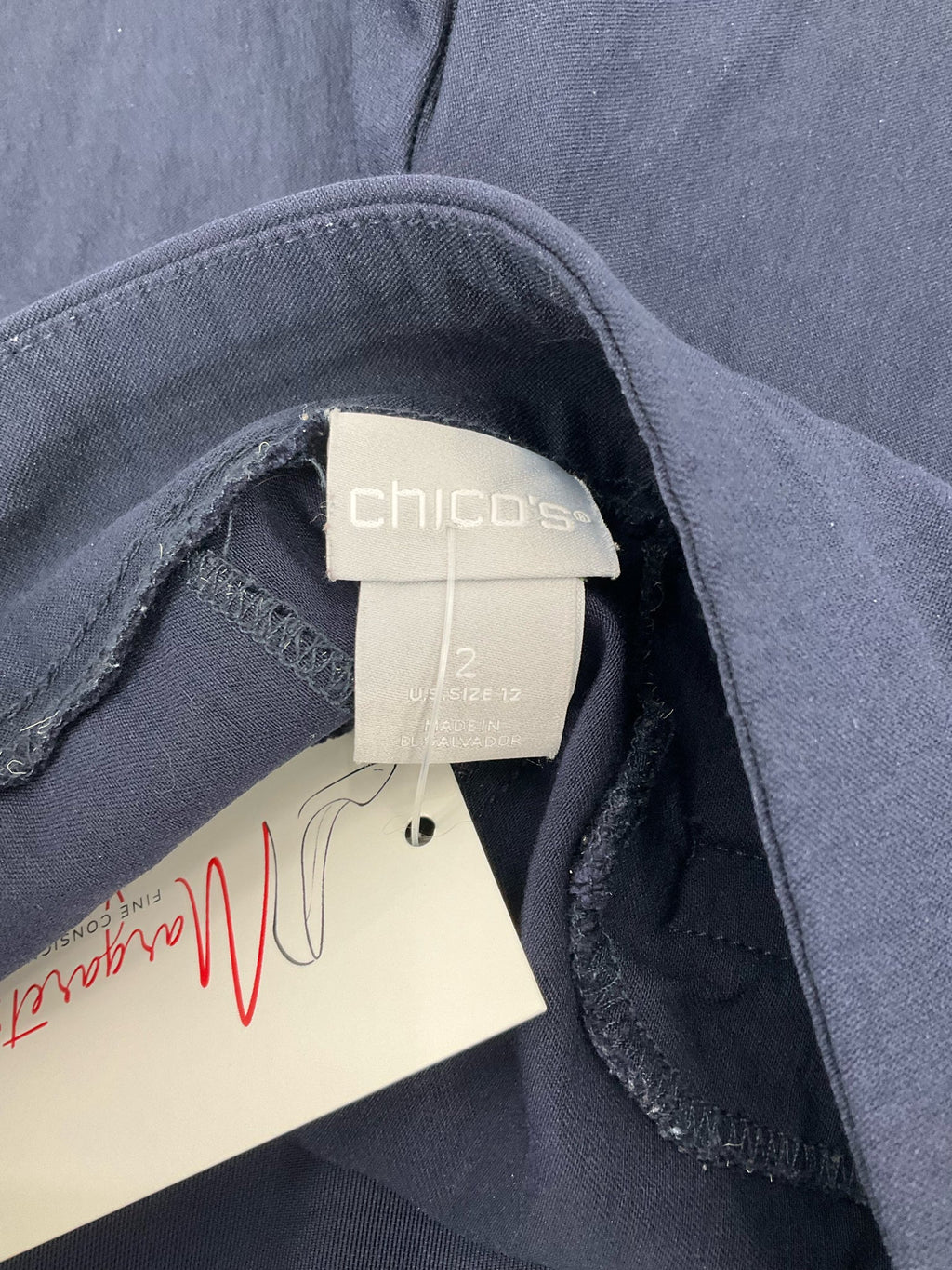 Chico's navy solid Bermuda shorts, pre-owned, size 12, pull-on style with flat front and stretch fabric.