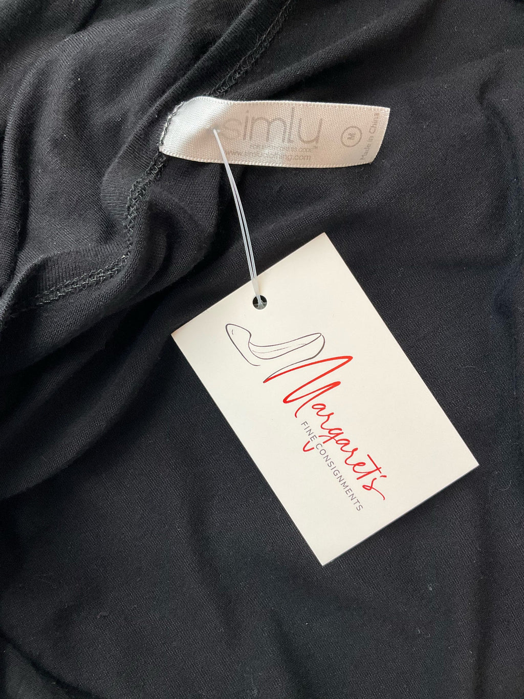 Black solid Simlu ladies top in size medium, featuring a batwing dolman style and casual tunic design.