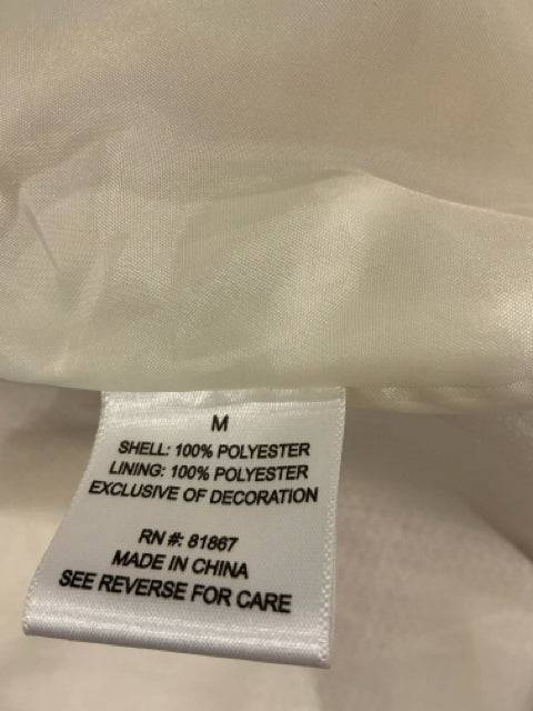 Interior label of J.J. Winter Vest Size Medium showing 100% polyester shell and lining, made in China. Available at Margaret’s Fine Consignments.