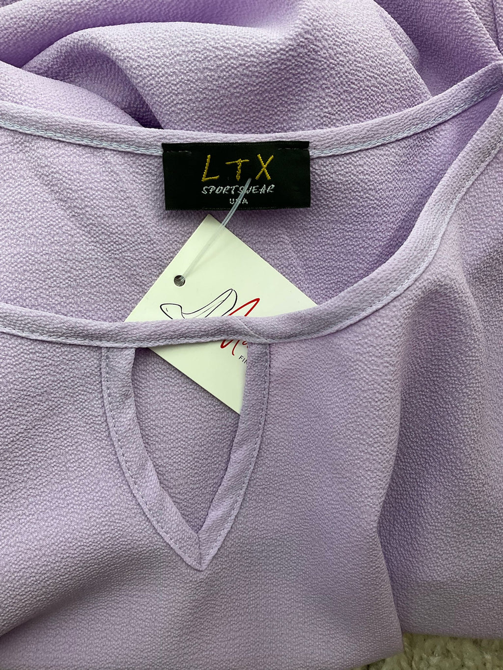 LTX Sportswear lavender solid pre-owned ladies top, size large, featuring a bohemian casual tunic style.